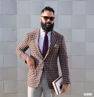 Dark Brown Gingham Blazer Outfits For Men: Marrying a dark brown gingham blazer with grey wool dress pants is an amazing choice for a smart and refined ensemble.