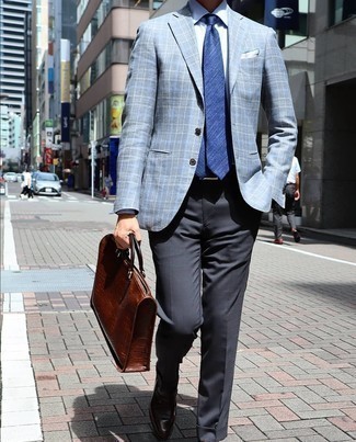 Briefcase Outfits: For a casual menswear style with an edgy finish, you can dress in a light blue plaid blazer and a briefcase. A pair of dark brown leather loafers will take this look a more sophisticated path.