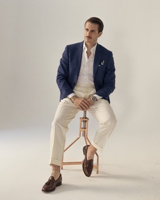 Navy Blazer Dressy Outfits For Men: A navy blazer and beige dress pants are a polished getup that every modern guy should have in his sartorial collection. For extra style points, complement this ensemble with a pair of brown leather tassel loafers.
