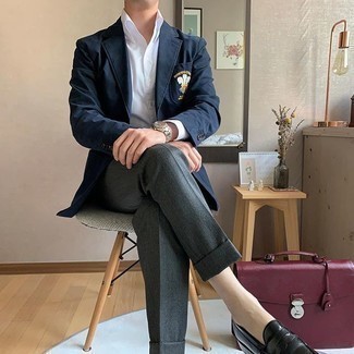 Briefcase Outfits: This relaxed combo of a navy embroidered blazer and a briefcase can take on different nuances according to how you style it. And if you need to instantly polish up this look with footwear, complement your outfit with a pair of black leather loafers.