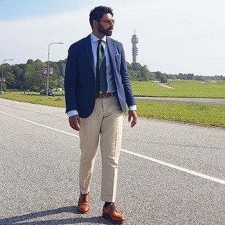 Brown Sunglasses Outfits For Men: This pairing of a navy blazer and brown sunglasses is super stylish and creates instant appeal. Here's how to breathe a dose of polish into this outfit: tobacco leather brogues.