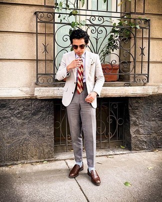 Red Horizontal Striped Tie Outfits For Men: Rock a beige blazer with a red horizontal striped tie for manly elegance with a fashionable spin. Brown leather loafers are a wonderful choice to complete your ensemble.