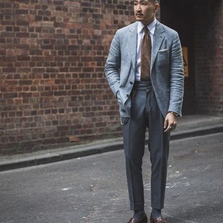 Light Blue Blazer Outfits For Men: Consider teaming a light blue blazer with charcoal dress pants for truly classic attire. Dark brown leather tassel loafers round off this getup very nicely.