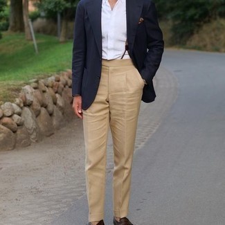 Tan Suspenders Outfits: Hard proof that a navy blazer and tan suspenders are amazing when worn together in a city casual look. Go the extra mile and change up your ensemble by finishing off with dark brown leather tassel loafers.