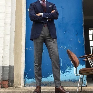 Burgundy Tie Outfits For Men: Pair a navy blazer with a burgundy tie to look crisp and classic. A pair of brown leather oxford shoes will be the perfect complement to this ensemble.