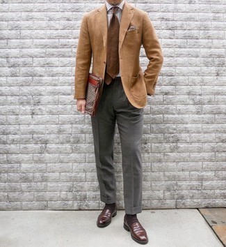 Brown Canvas Zip Pouch Outfits For Men: If you're a fan of comfort dressing when it comes to fashion, you'll appreciate this urban combo of a tan blazer and a brown canvas zip pouch. Brown leather loafers are an easy way to give an added dose of style to this getup.