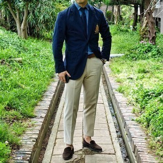 Navy Embroidered Blazer Outfits For Men: Teaming a navy embroidered blazer and beige dress pants is a fail-safe way to infuse your current styling repertoire with some manly sophistication. For extra fashion points, complement this ensemble with a pair of dark brown suede loafers.