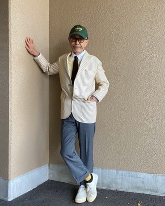 Olive Baseball Cap Outfits For Men: If you’re a jeans-and-a-tee kind of guy, you'll like this pared down pairing of a beige vertical striped blazer and an olive baseball cap. Break up your look by wearing a pair of white canvas low top sneakers.