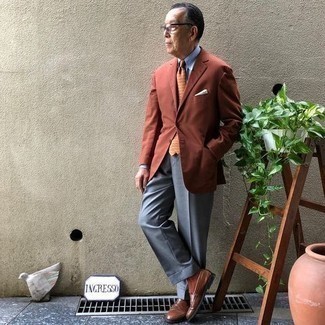 Tobacco Blazer Outfits For Men: This refined pairing of a tobacco blazer and grey dress pants is a common choice among the sartorially superior gents. If you're hesitant about how to finish off, introduce a pair of brown leather loafers to the mix.