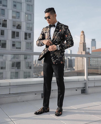 Floral Blazer Outfits For Men: This pairing of a floral blazer and black floral dress pants comes to rescue when you need to look classy and seriously smart. Black embroidered velvet loafers act as the glue that will bring your look together.