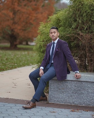 Dark Purple Blazer Outfits For Men: Solid proof that a dark purple blazer and navy dress pants look awesome when combined together in a polished ensemble for today's man. If you want to instantly dial down your look with a pair of shoes, introduce a pair of brown leather brogues to your getup.