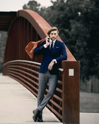 Brown Leather Duffle Bag Outfits For Men: You're looking at the irrefutable proof that a navy blazer and a brown leather duffle bag look awesome when married together in a casual street style look. Channel your inner David Gandy and add black leather chelsea boots to this ensemble.