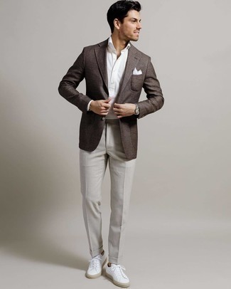 Charcoal Dress Pants with White Canvas Low Top Sneakers Summer Outfits For Men: A dark brown blazer and charcoal dress pants are absolute staples if you're figuring out a sharp closet that holds to the highest sartorial standards. Take your ensemble in a more casual direction by sporting a pair of white canvas low top sneakers. This outfit is a tested option if you're hunting for a great, season-appropriate outfit.