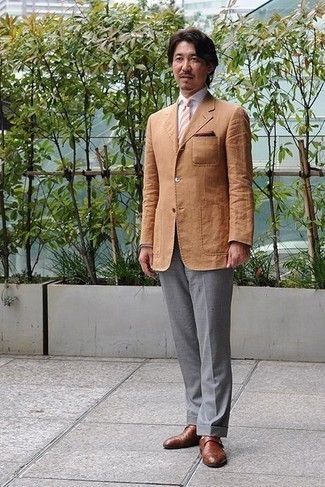 Tobacco Blazer Outfits For Men: Make a powerful entrance anywhere you go in a tobacco blazer and grey dress pants. Brown leather monks are a welcome addition for this ensemble.