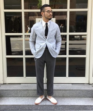 White Canvas Loafers Outfits For Men: This sophisticated combination of a light blue horizontal striped blazer and charcoal dress pants will prove your sartorial skills. Add a pair of white canvas loafers to the equation and you're all done and looking killer.