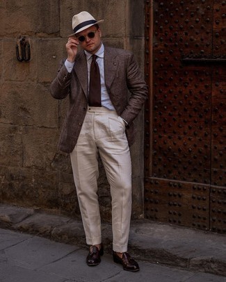 Burgundy Leather Tassel Loafers Outfits: Channel your inner James Bond and make a dark brown plaid blazer and beige dress pants your outfit choice. Burgundy leather tassel loafers will pull the whole thing together.