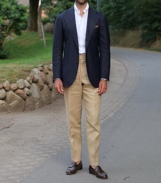 Navy Blazer Dressy Outfits For Men: Putting together a navy blazer with khaki dress pants is an on-point idea for a classic and polished look. Complement this look with dark brown leather loafers and the whole getup will come together wonderfully.