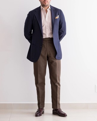Brown Dress Pants Outfits For Men: We're loving how this combination of a navy blazer and brown dress pants instantly makes you look sharp and polished. A pair of burgundy leather derby shoes looks perfect rounding off this look.