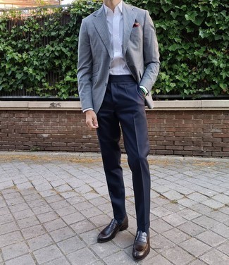 Grey Gingham Blazer Outfits For Men: Putting together a grey gingham blazer and navy dress pants is a fail-safe way to inject your day-to-day repertoire with some masculine elegance. Consider dark brown leather loafers as the glue that will bring your outfit together.