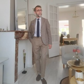 Light Blue Vertical Striped Dress Shirt with Beige Dress Pants Outfits For Men: Try pairing a light blue vertical striped dress shirt with beige dress pants for an incredibly sharp ensemble. A pair of dark brown suede tassel loafers is very fitting here.
