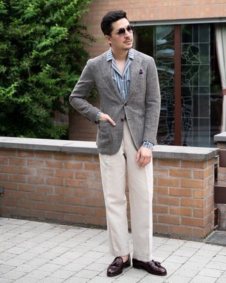 Beige Dress Pants Outfits For Men: A grey blazer and beige dress pants are a polished combo that every sharp gentleman should have in his sartorial collection. Dark brown leather tassel loafers are a nice idea to complete your getup.