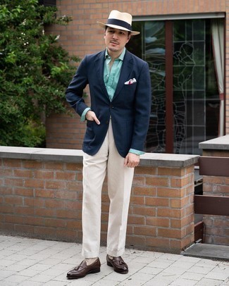 Beige Dress Pants Outfits For Men: Pair a navy blazer with beige dress pants for a seriously smart look. This outfit is finished off perfectly with dark brown leather tassel loafers.