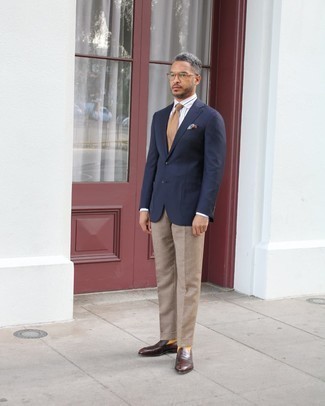 500+ Outfits For Men After 40: This outfit demonstrates it pays to invest in such smart menswear items as a navy blazer and khaki dress pants. The whole look comes together if you introduce dark brown leather loafers to the mix. This ensemble looks great on middle-aged gents.