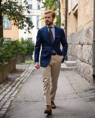Khaki Vertical Striped Dress Pants Outfits For Men: Bring your sartorial A-game in a navy blazer and khaki vertical striped dress pants. Complement your look with dark brown suede loafers to tie the whole thing together.
