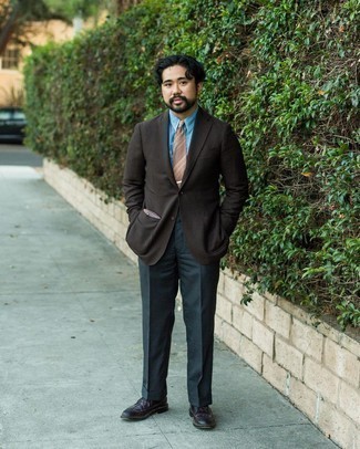 Dark Brown Blazer Outfits For Men: A dark brown blazer and charcoal dress pants? Make no mistake, this ensemble will turn every head around. Infuse a touch of stylish casualness into this outfit by wearing dark brown leather brogues.