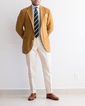 Tobacco Blazer Outfits For Men: Go for a tobacco blazer and beige dress pants for a stylish and sophisticated look. Tobacco leather loafers integrate effortlessly within many combinations.