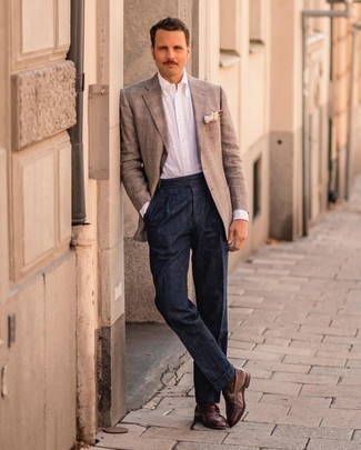 White Dress Shirt Dressy Outfits For Men: This combo of a white dress shirt and navy dress pants is seriously dapper and creates instant appeal. Finishing with dark brown leather loafers is an easy way to bring a dash of stylish nonchalance to your outfit.