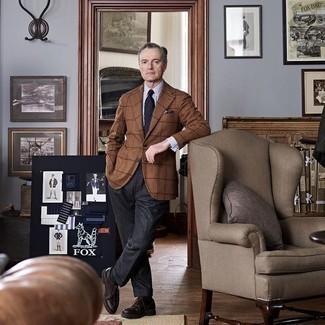 Blazer Outfits For Men After 50: This ensemble proves it pays to invest in such timeless menswear items as a blazer and charcoal wool dress pants. As for shoes, complement your outfit with dark brown leather derby shoes. Looking for dressing tips for over-50 gents? This getup is great inspo.