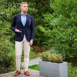 Brown Suede Tassel Loafers Outfits: Consider teaming a navy blazer with beige dress pants to look like a modern dandy with a good deal of style. We're loving how complete this outfit looks when finished off by a pair of brown suede tassel loafers.