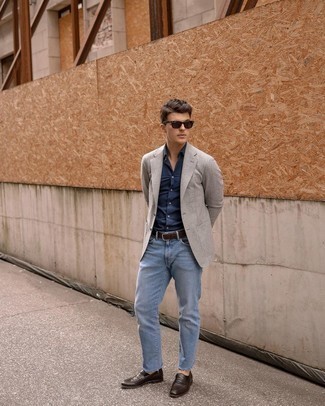 Grey Blazer Smart Casual Outfits For Men: This pairing of a grey blazer and light blue jeans crosses the divide between elegant and off-duty. Why not complete your outfit with a pair of dark brown leather loafers for an added touch of style?