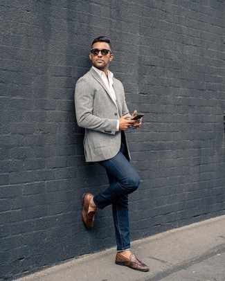 Grey Check Blazer Outfits For Men: For something more on the casually cool end, wear a grey check blazer and navy jeans. Got bored with this look? Invite dark brown leather tassel loafers to change things up a bit.