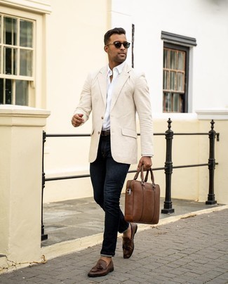 Black Jeans Outfits For Men: A beige blazer and black jeans matched together are a sartorial dream for those who love effortlessly polished combinations. And if you want to easily lift up this getup with one single piece, why not add a pair of dark brown leather tassel loafers to the equation?