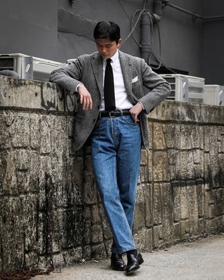 Blue Jeans Outfits For Men: This casual combination of a grey herringbone wool blazer and blue jeans comes to rescue when you need to look cool in a flash. Round off with a pair of black leather loafers to power up this outfit.