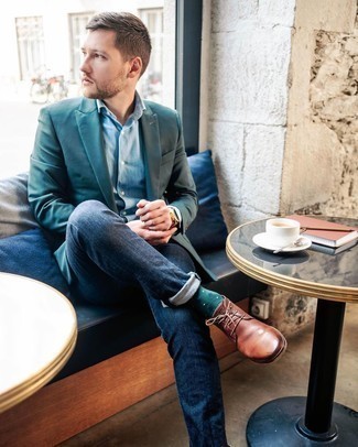 Brown Leather Desert Boots Outfits: For an ensemble that's pared-down but can be dressed up or down in a myriad of different ways, consider pairing a dark green blazer with navy jeans. All you need now is a pair of brown leather desert boots to finish this getup.