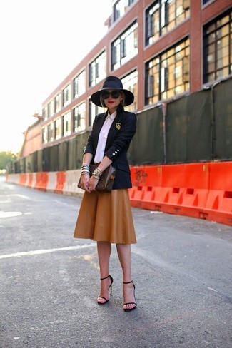 Brown Pleated Midi Skirt Outfits: Rock a navy blazer with a brown pleated midi skirt for a laid-back getup with a twist. The whole ensemble comes together if you add black leather heeled sandals to the mix.
