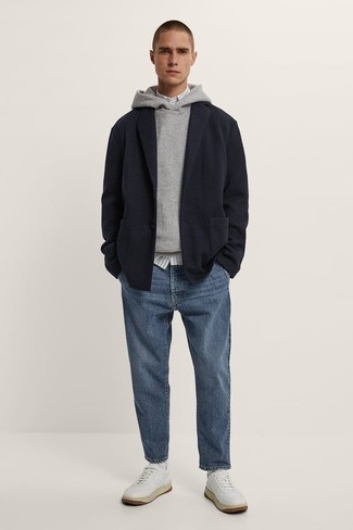 Grey Hoodie Outfits For Men: If you're hunting for a laid-back yet on-trend outfit, go for a grey hoodie and blue jeans. White leather low top sneakers integrate perfectly within a ton of combos.