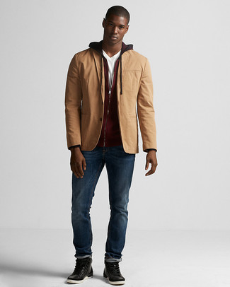 Tan Cotton Blazer Outfits For Men: This combination of a tan cotton blazer and navy jeans is irrefutable proof that a straightforward look can still be extra sharp. Black leather casual boots pull the look together.