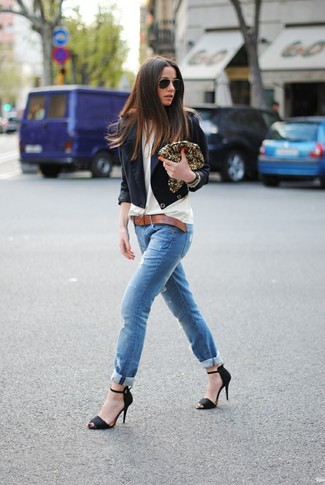 White and Black Long Sleeve Blouse Outfits: This combination of a white and black long sleeve blouse and blue ripped skinny jeans is an obvious choice for off duty. For something more on the classy end to complete your look, complement this outfit with black suede heeled sandals.
