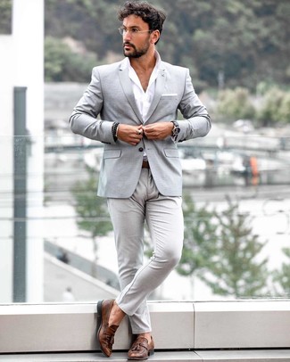 Black Beaded Bracelet Outfits For Men: For a laid-back and cool look, reach for a grey blazer and a black beaded bracelet — these pieces work pretty good together. Wondering how to finish off your look? Rock brown leather tassel loafers to ramp it up.