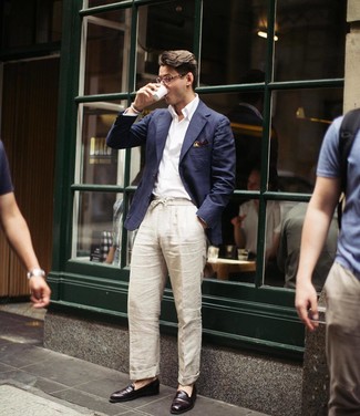 Beige Linen Chinos Outfits: This semi-casual pairing of a navy blazer and beige linen chinos is extremely easy to pull together without a second thought, helping you look dapper and ready for anything without spending a ton of time rummaging through your wardrobe. Give an elegant twist to an otherwise too-common ensemble with dark brown leather loafers.