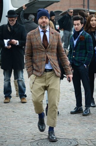 Brown Plaid Wool Blazer Outfits For Men: This outfit shows it pays to invest in such menswear items as a brown plaid wool blazer and khaki chinos. For something more on the elegant end to finish off your ensemble, introduce a pair of black leather derby shoes to the equation.