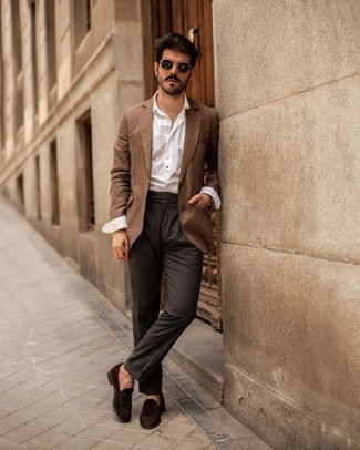 White Long Sleeve Shirt Dressy Outfits For Men: Marrying a white long sleeve shirt and charcoal dress pants is a fail-safe way to breathe style into your current rotation. Complete your ensemble with a pair of dark brown suede tassel loafers and ta-da: the getup is complete.