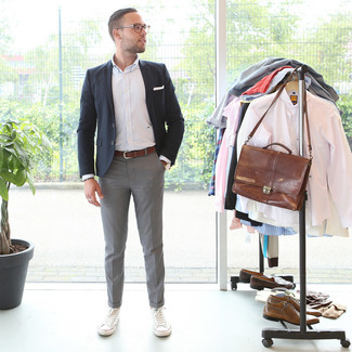 Black Blazer Outfits For Men: Combining a black blazer and grey dress pants is a fail-safe way to inject your closet with some manly elegance. For a fashionable hi-low mix, throw a pair of white canvas low top sneakers in the mix.