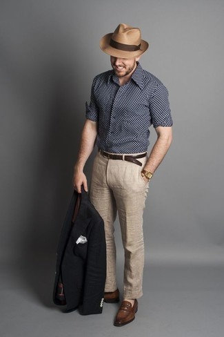 Navy and White Polka Dot Long Sleeve Shirt Outfits For Men: This combo of a navy and white polka dot long sleeve shirt and beige linen dress pants is a fail-safe option when you need to look seriously dapper and elegant. Introduce a pair of brown leather loafers to the mix to completely switch up the ensemble.