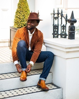 Tobacco Corduroy Blazer Outfits For Men: You'll be amazed at how easy it is for any man to get dressed this way. Just a tobacco corduroy blazer worn with navy jeans. Inject this ensemble with a touch of sophistication by rocking tobacco leather chelsea boots.
