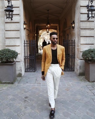 Gold Bracelet Outfits For Men: A tobacco blazer and a gold bracelet are a savvy pairing to work at the weekend. Complement this look with black leather loafers to immediately boost the classy factor of this outfit.